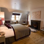 Master bedroom suite with log fire, luxury holiday house, Shieldaig, Scotland